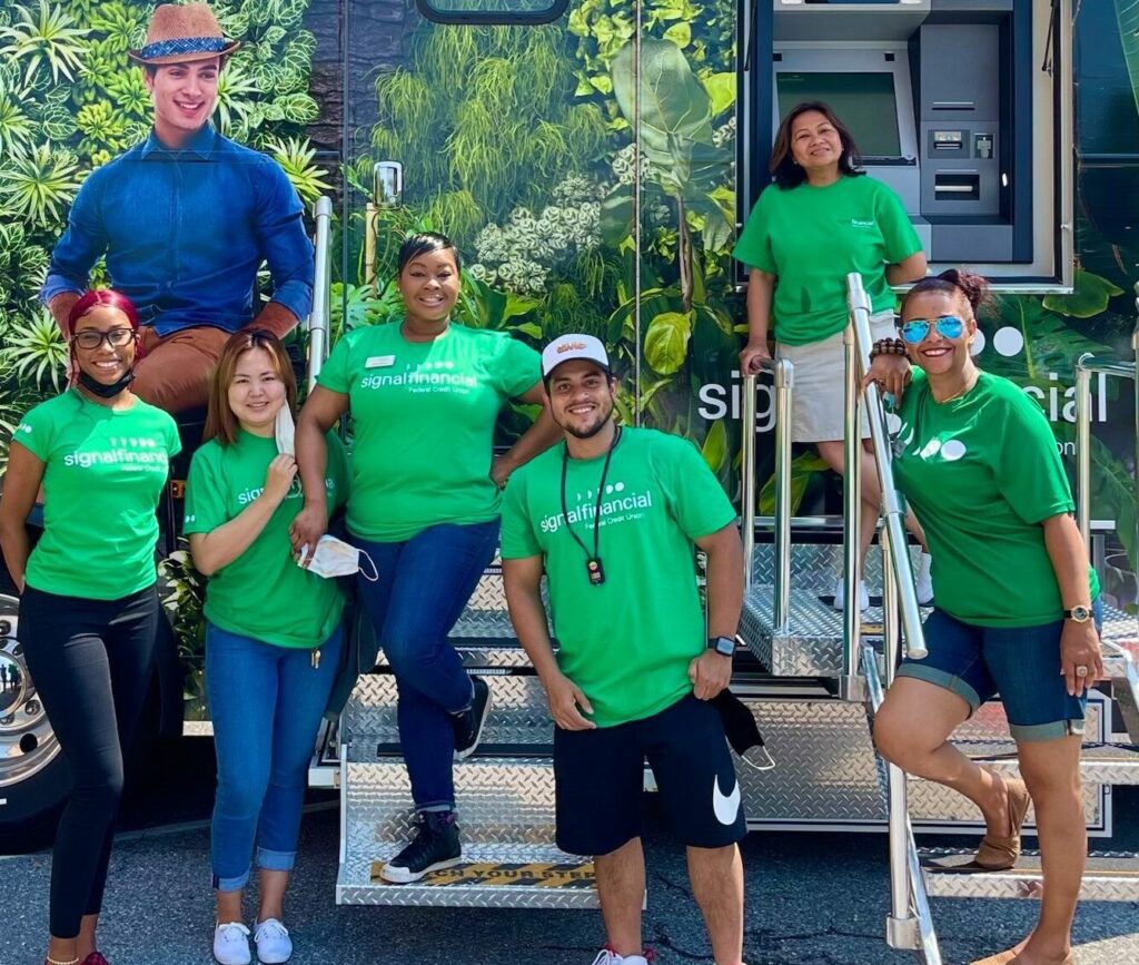 photo of signal financial employees with the career opportunity and job openings mobile unit