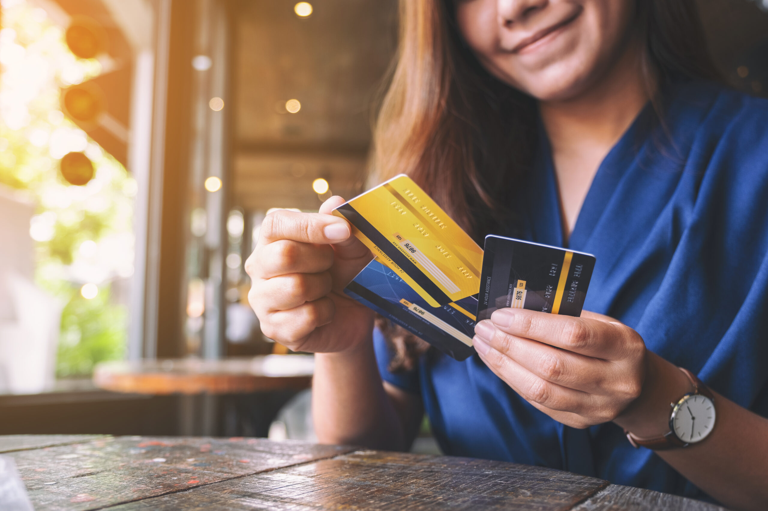 Woman looking at credit cards