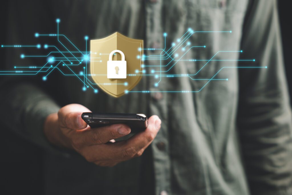 Ensure mobile privacy and security with a cybersecurity concept. Business professionals employ encryption and key icons on virtual interface shields to protect personal information on smartphones.