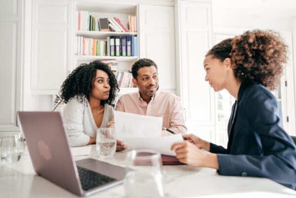 Financial advisor helping a middle aged couple