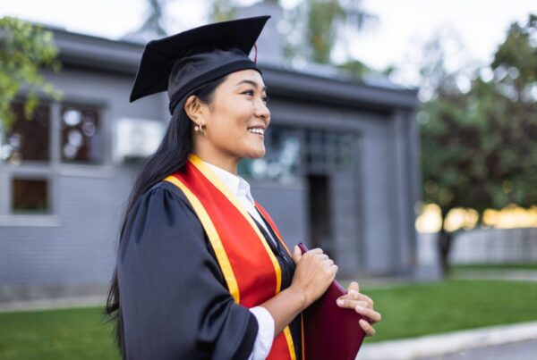 College graduate with a diploma in hand