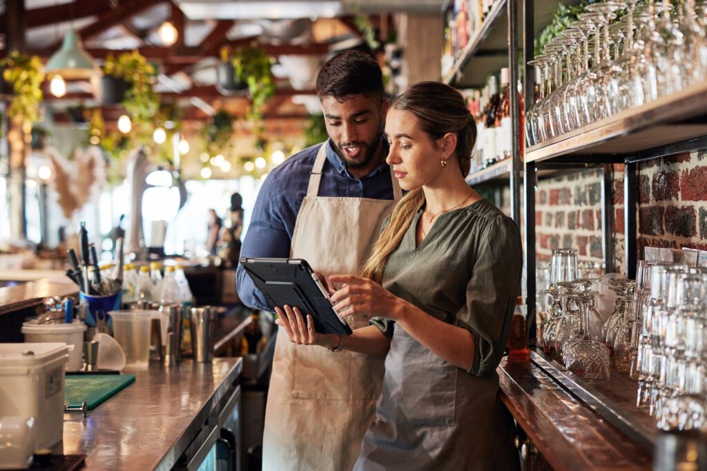 Chefs looking at their POS system