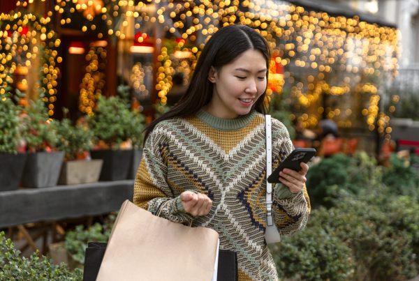 Happy woman holiday shopping.