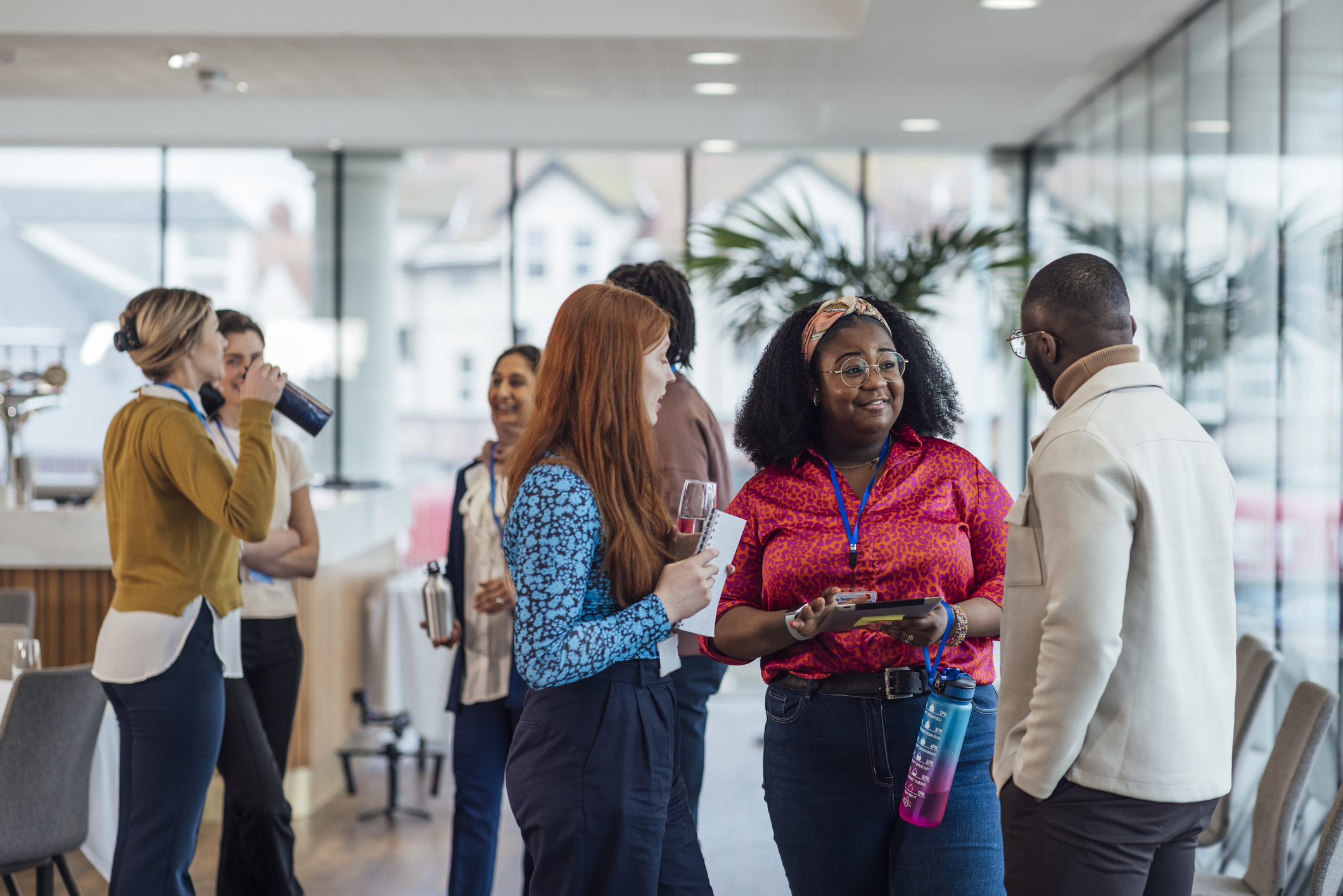 Group of diverse individuals networking at a social event.