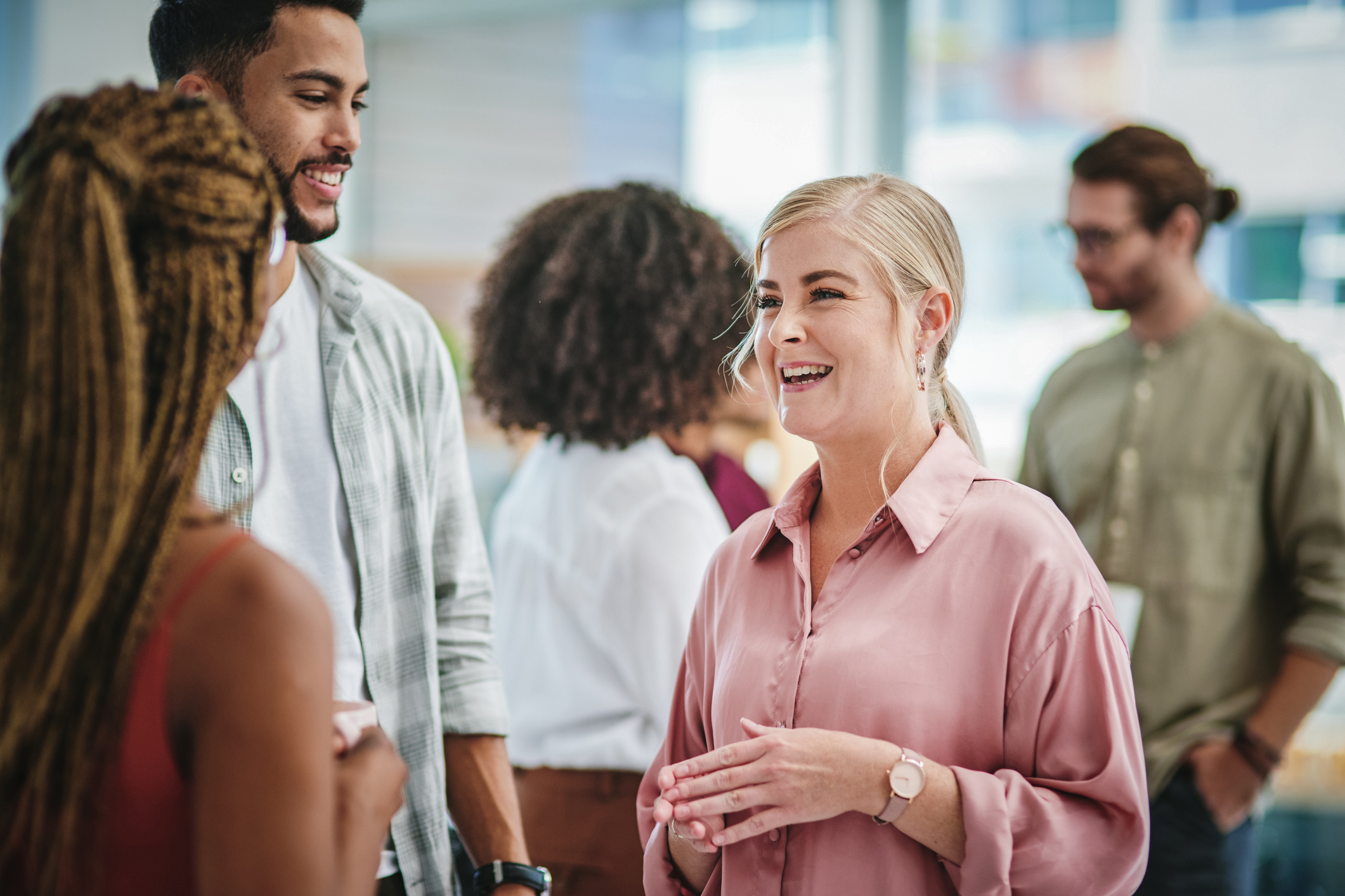 People talking at corporate event.