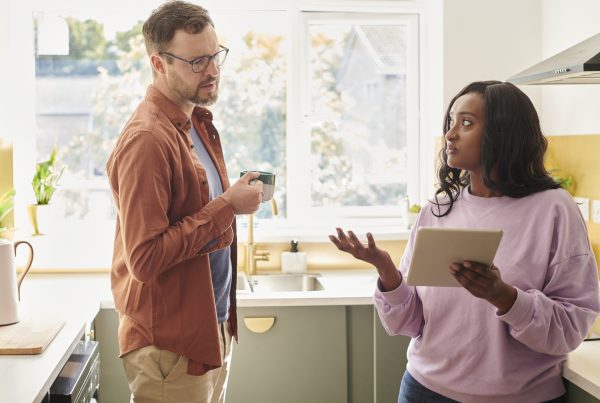 Young couple debating their online banking.