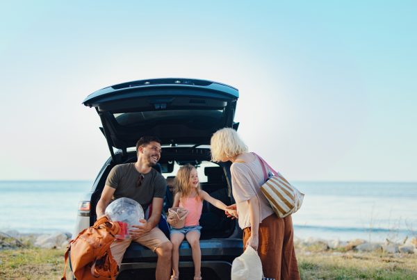 Happy Family Vacation Together by the Scenic Sea During Summer