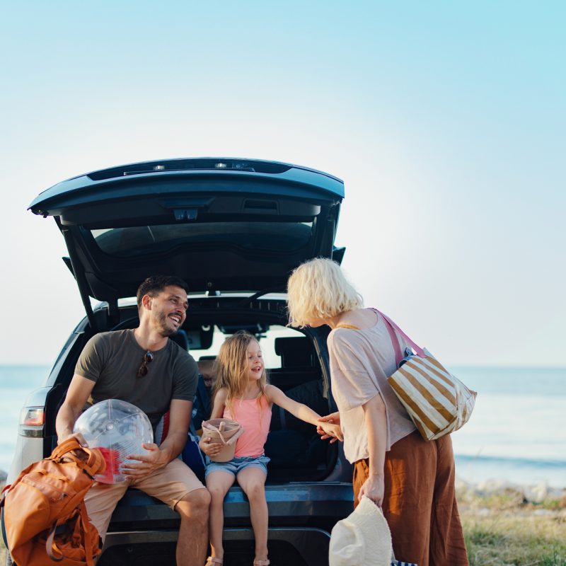 Happy Family Vacation Together by the Scenic Sea During Summer
