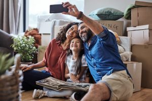 Happy Family Taking a Selfie at Their New Home During Moving Day